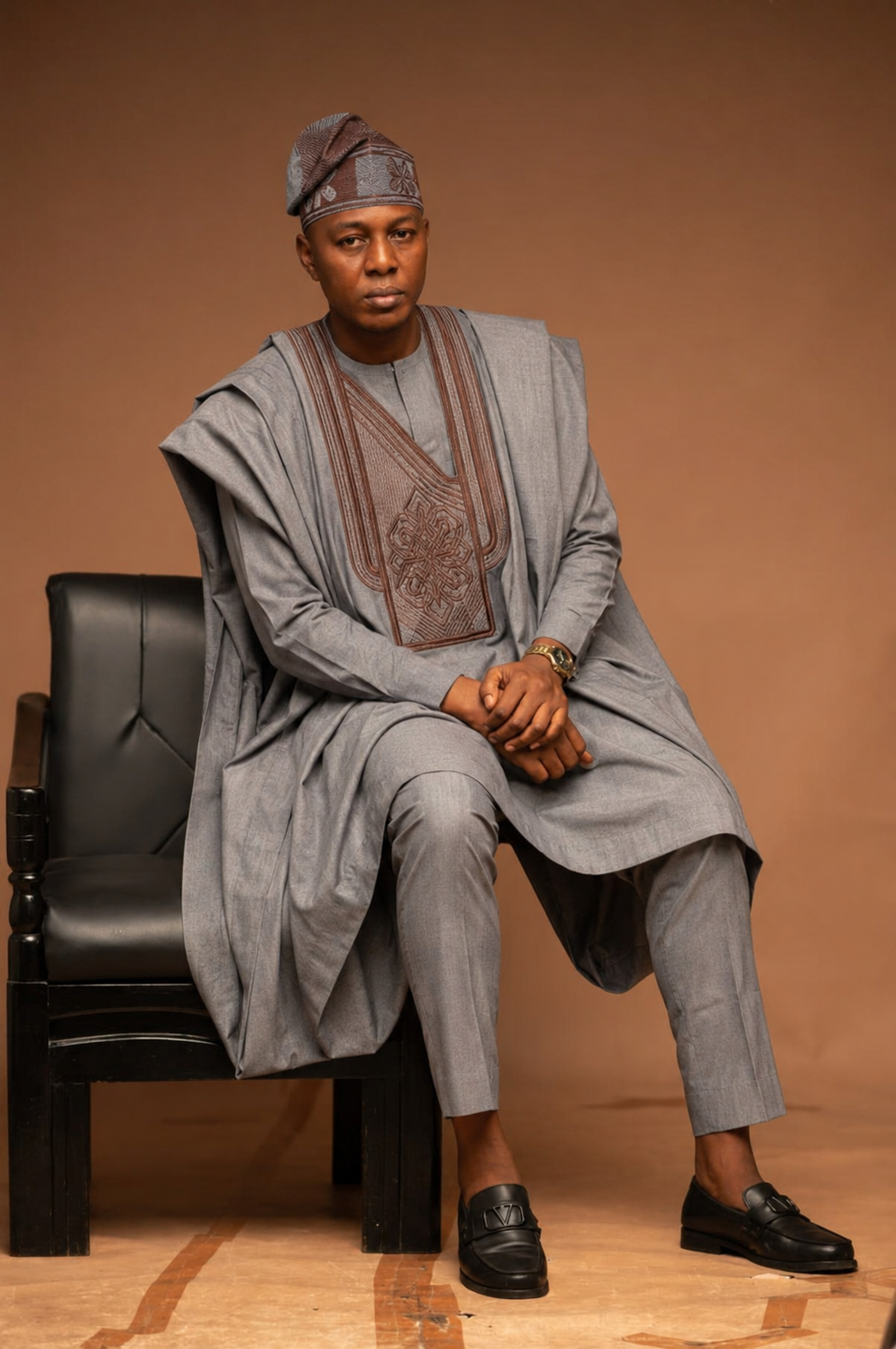 Andafa Darling seated in traditional agbada attire